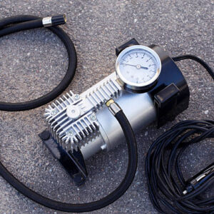 The pump to inflate automobile wheels lying on the floor