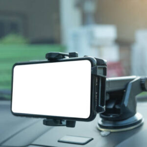 Gps navigation in mobile phone while driving car at sunrise